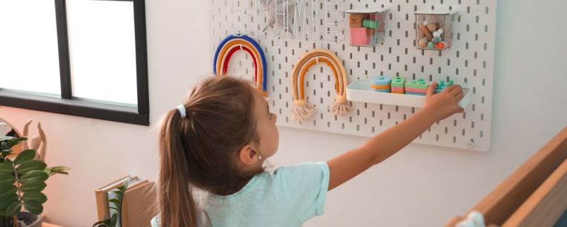 Wall-mounted storage displaying toys
